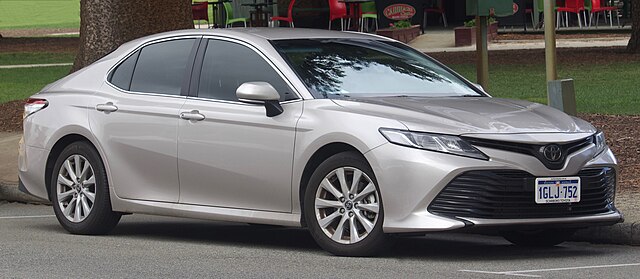 Japanese-brand hybrid sedan photo representing automaker employment and dealer networks.